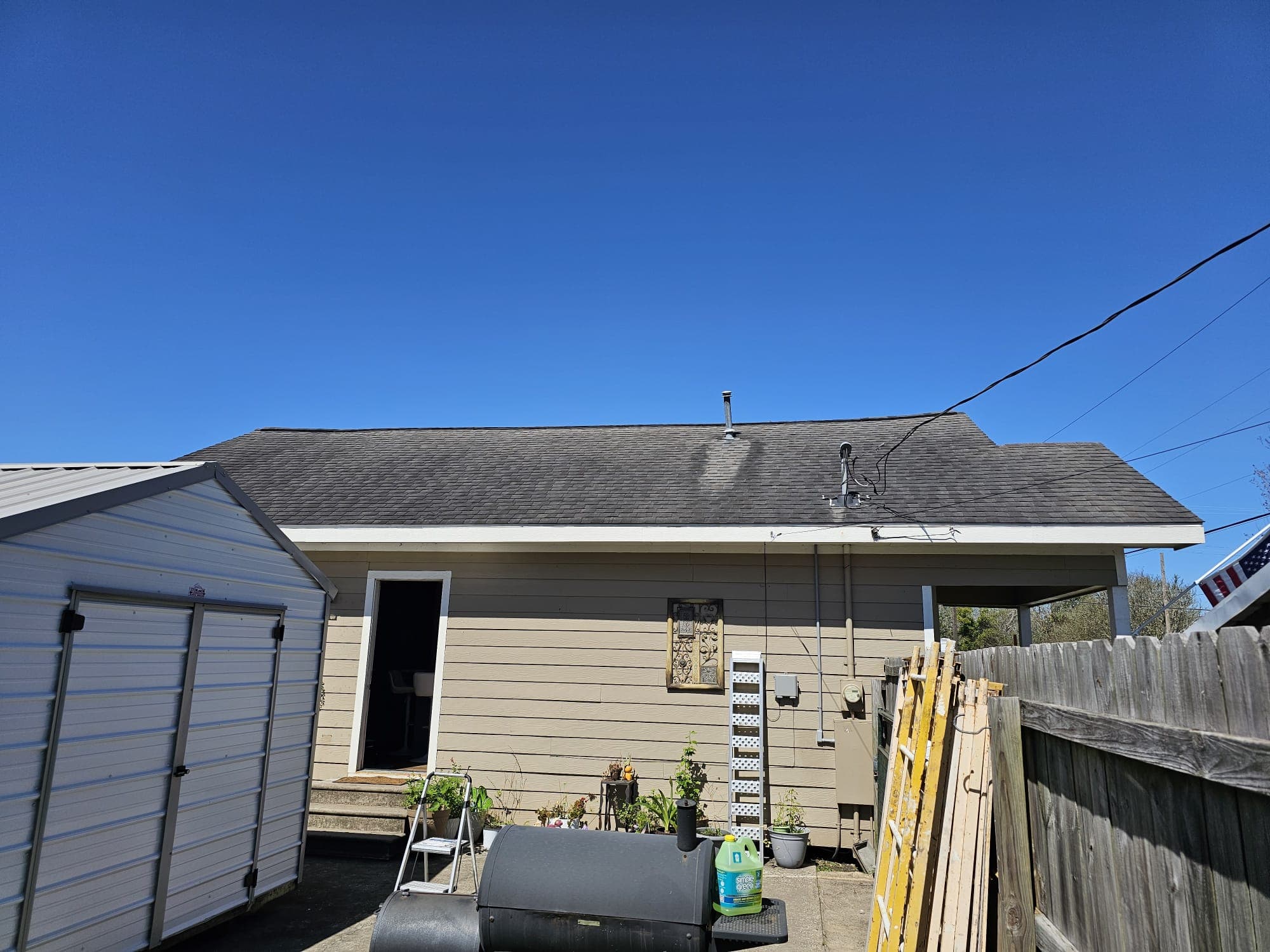 Aged asphalt shingle roof before Roof Rejoov treatment in Katy, TX